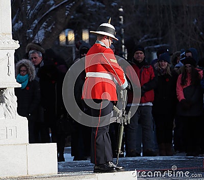 Soldier Standing At Cenotaph For Remembrance Day Editorial Stock Photo