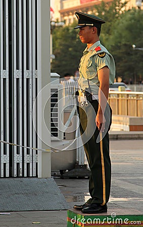 Soldier stands guard at the entrance to Tiananmen square Editorial Stock Photo