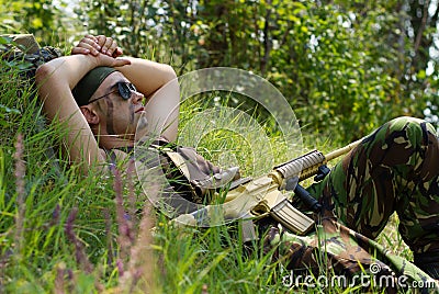 Soldier is taking a rest when the battle is over Stock Photo