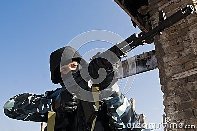 Soldier targeting with automatic rifle Stock Photo