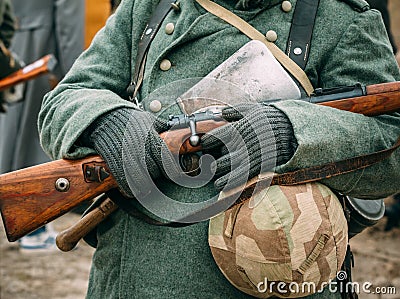 Soldier in winter uniform with a rifle in his hands Stock Photo