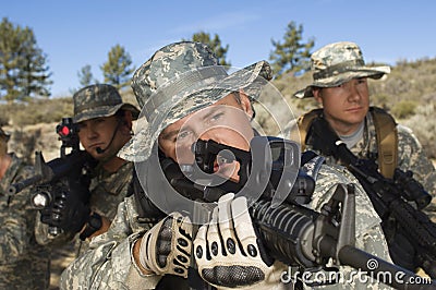 Soldiers Aiming Machine Guns Stock Photo