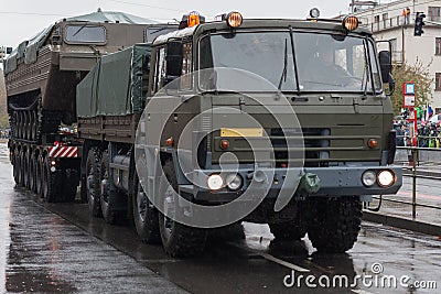 Soldiers of Czech Army are riding military truck with floating transporter Stock Photo