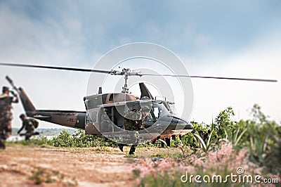 Soldiers holding gun and jumping from the helicopter Editorial Stock Photo