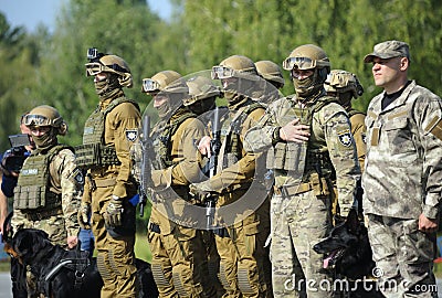 Soldiers of KORD police special forces, and police dogs standing in the line on the ground Editorial Stock Photo