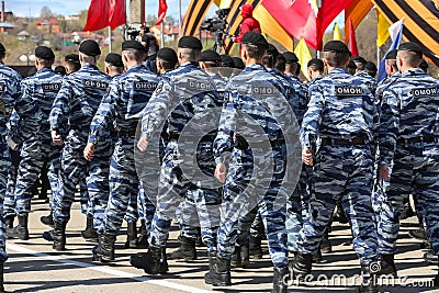 Soldiers at a military parade. Russia. On the backs is written the abbreviation in Russian OMON. Editorial Stock Photo