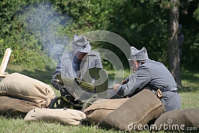 Soldiers operating a machine gun Stock Photo