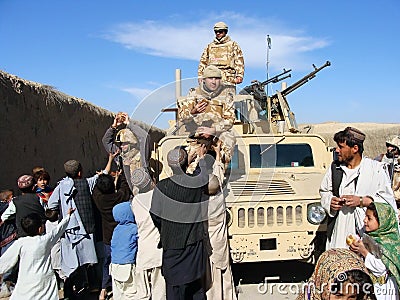 Soldiers sharing food in Afghanistan Editorial Stock Photo