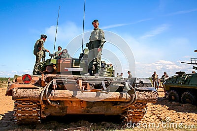 Soldiers on tank in military training Saber Strike in Latvia Editorial Stock Photo