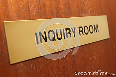 Inquiry room sign on a wooden door. Stock Photo