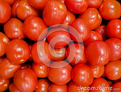 A solid background of ripe tomatoes without leaves Stock Photo