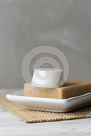 Solid shampoo and conditioner bars in soap dish Stock Photo