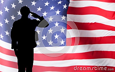 Solider Saluting Against The American Flag Stock Photo