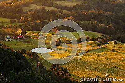 Countryside solitary farm with pond by sunset Stock Photo