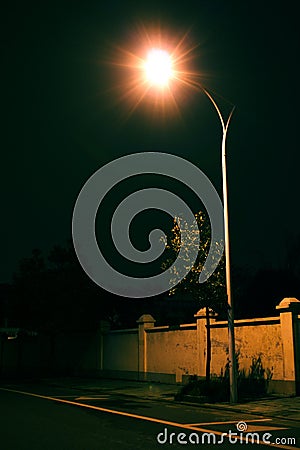 Solitary street lamp in the night Stock Photo