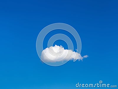 Solitary white cloud in blue sky Stock Photo