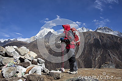 Solitude lady trekking in Himalayas region Stock Photo
