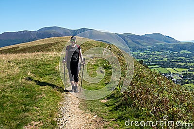 Solo hiker in the Lake District. Stock Photo