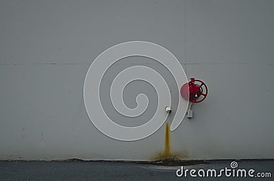 A solo red fire valve and drain Stock Photo