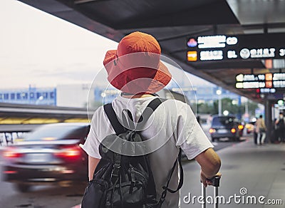 Solo traveler carry luggage walking in airport Stock Photo