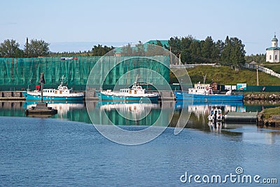 Solovetsky islands, Russia - August 10, 2019: Monastery vessels St. Nicholas, St. Philip and service and auxiliary vessel Pechak Editorial Stock Photo