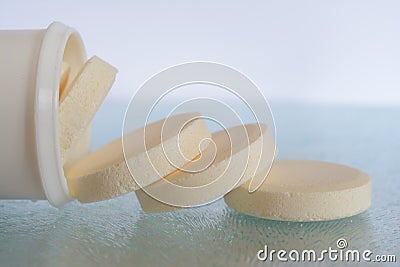 Soluble tablets falling out the plastic tube Stock Photo