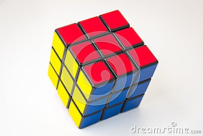 Solved colorful magic cube puzzle on white background Editorial Stock Photo
