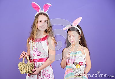 Some bunny loves you. Small girls in bunny headband for Easter celebration. Little girls wearing Easter bunny ears. Cute Stock Photo