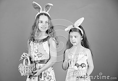 Some bunny loves you. Small girls in bunny headband for Easter celebration. Little girls wearing Easter bunny ears. Cute Stock Photo