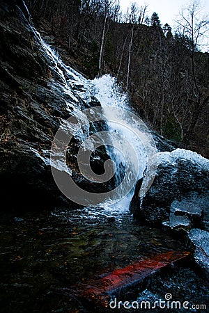 Waterfall and rocks and ice Stock Photo