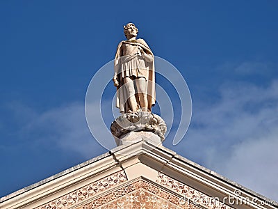 Traditional statue as a decoration on the roof of a classic house in Leiria Stock Photo