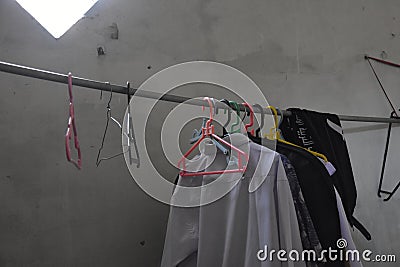 some clothes are dried and hung indoors, laundry, clothesline Stock Photo