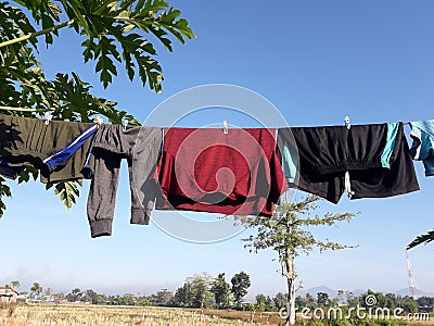 some clothes that are dried in the yard and become one of the uses of sunlight Stock Photo