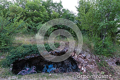 Some colorful bicycles in a cave on Subasio mountain, near Assisi Umbria Stock Photo