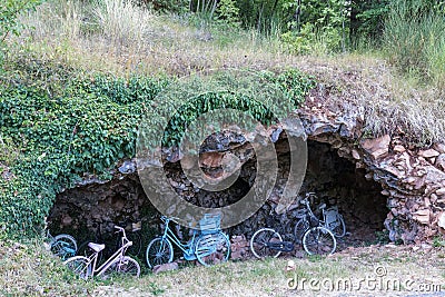 Some colorful bicycles in a cave on Subasio mountain, near Assisi Umbria Stock Photo