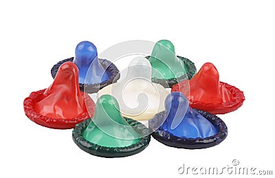 Some colour condoms on a white background Stock Photo