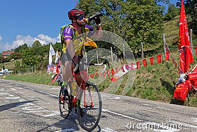 Some cyclo-tourists run the road of the Tour just before the race Editorial Stock Photo