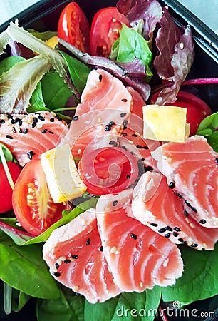 Delicious slices of scalded salmon with salad Stock Photo