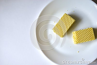 Some delicious sugar waffles on a white plate Stock Photo