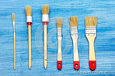 Some different brushes on a light blue background Stock Photo