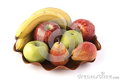 Some different fruits on a wooden dish Stock Photo