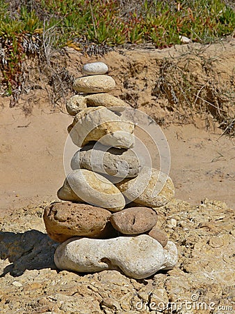 Mystical stone piles and figures on the beach in Albufeira, Algarve - Portugal Stock Photo