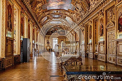 some fancy gold and marble paintings and some long room with wooden floors Editorial Stock Photo