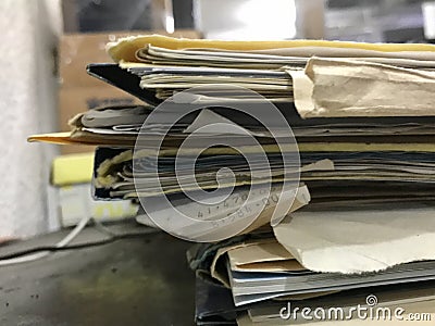 Some file folders stacked on top of a desk Stock Photo