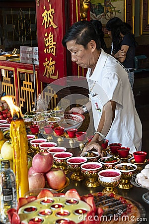 Food offerings in a temple in Bangkok Editorial Stock Photo
