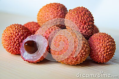 Some fresh lychees on a white cutting board Stock Photo