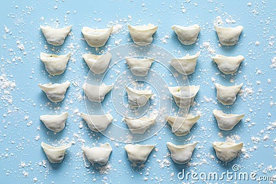 Some freshly wrapped wontons were placed on a silicone mat. Wonton delicacies. Stock Photo