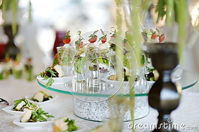 Some little glasses filled with delicious salad Stock Photo