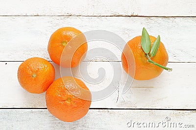 Some mandarines on a white wooden table Stock Photo