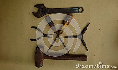 Some metal working tools on a brown background Stock Photo